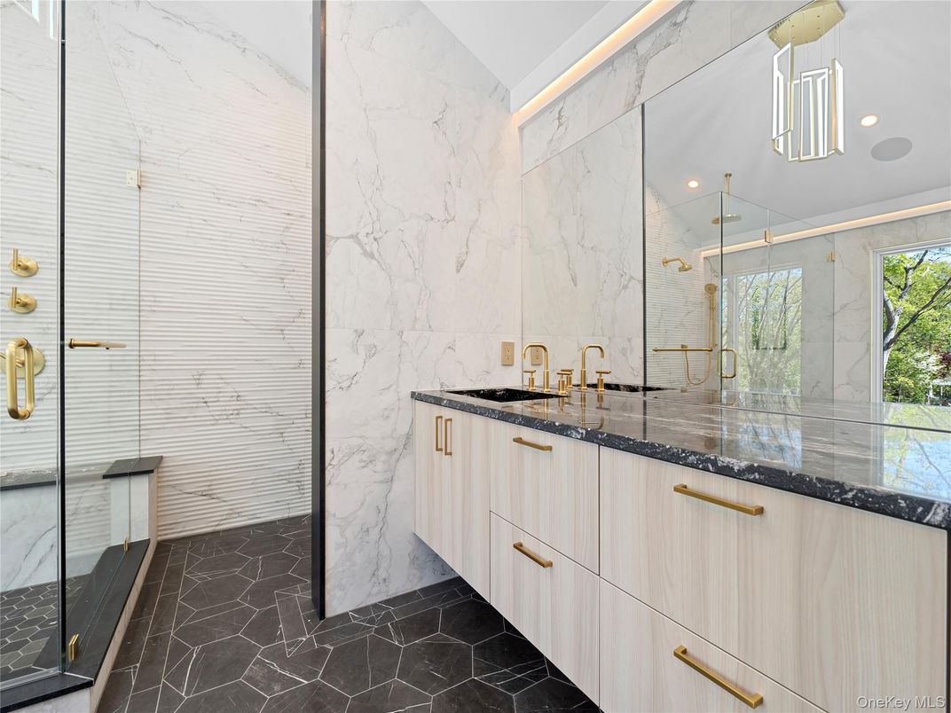 Bathroom, Dual Sink Vanities, Glass Shower, Interior, Marble, Marble Walls, Recessed Lighting