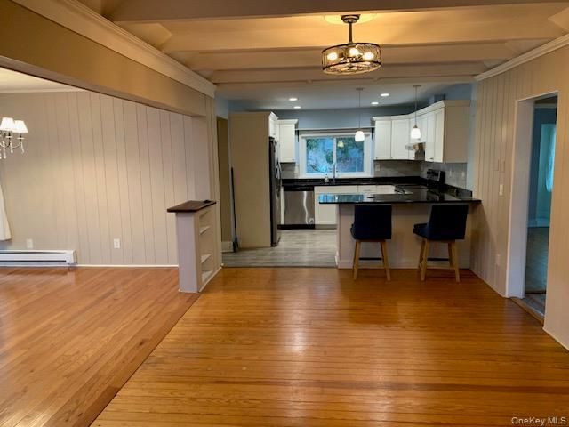 Chandelier, Interior, Kitchen, Pendant Lights, Recessed Lighting, Stainless Steel Appliances, Wood Texture Flooring