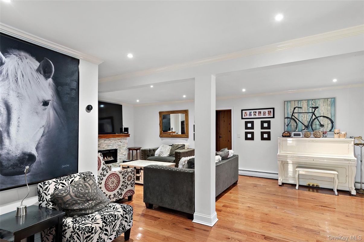 Fireplace, Interior, Living room, Piano, Recessed Lighting, Wood Texture Flooring