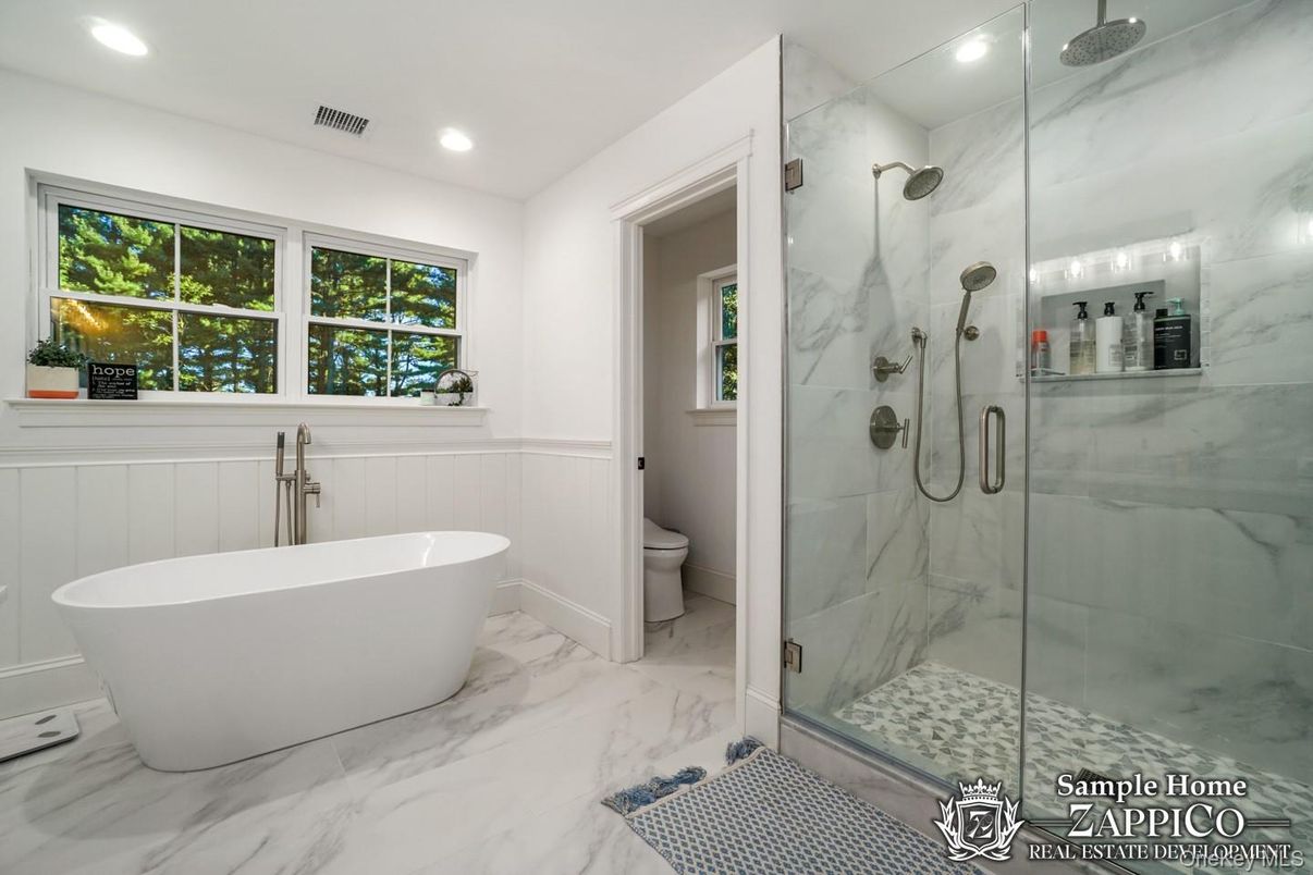 Bathroom, Free Standing Baths, Glass Shower, Interior, Marble, Marble Walls, Recessed Lighting