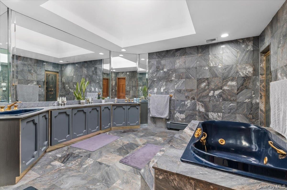 Bathroom, Dual Sink Vanities, Glass Shower, Interior, Marble Walls, Recessed Lighting