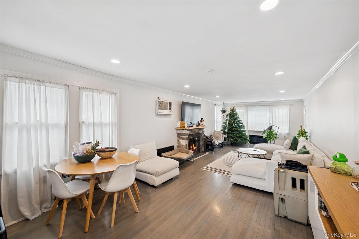 Dining room, Fireplace, Interior, Living room, Recessed Lighting, Wood Texture Flooring