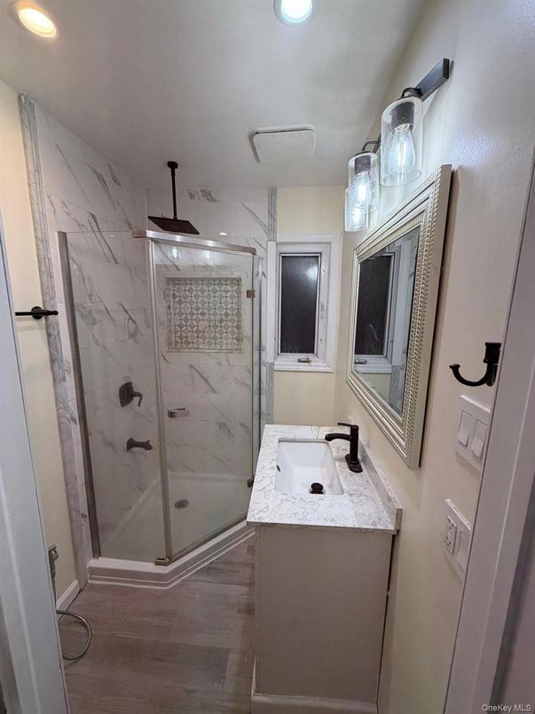Bathroom, Glass Shower, Interior, Marble Walls, Recessed Lighting, Wood Texture Flooring
