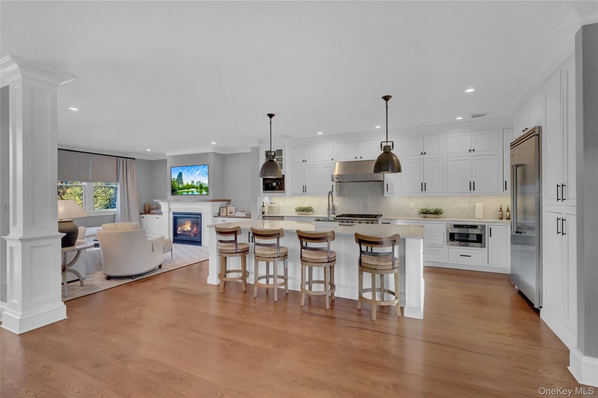 Fireplace, Interior, Kitchen, Living room, Pendant Lights, Recessed Lighting, Stainless Steel Appliances, Wood Texture Flooring