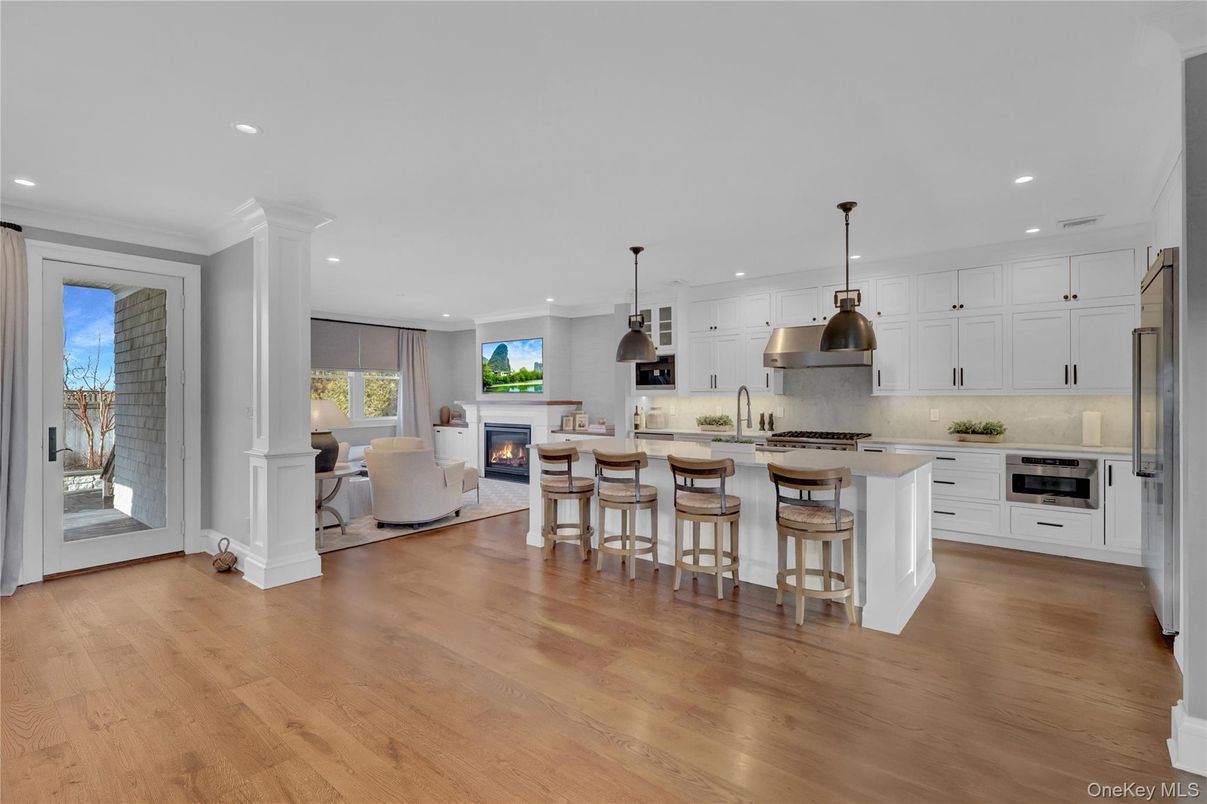 Fireplace, Interior, Kitchen, Living room, Pendant Lights, Recessed Lighting, Stainless Steel Appliances, Wood Texture Flooring