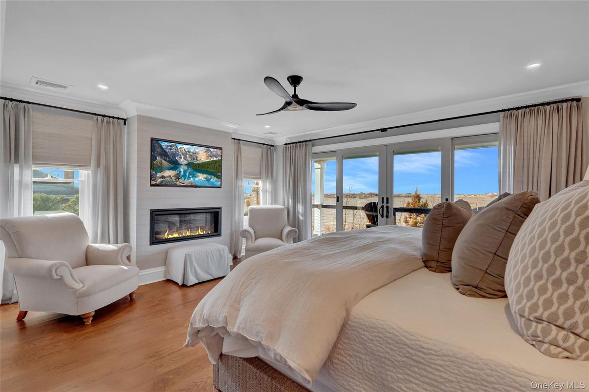 Bedroom, Fireplace, Interior, Recessed Lighting, Water, Wood Texture Flooring