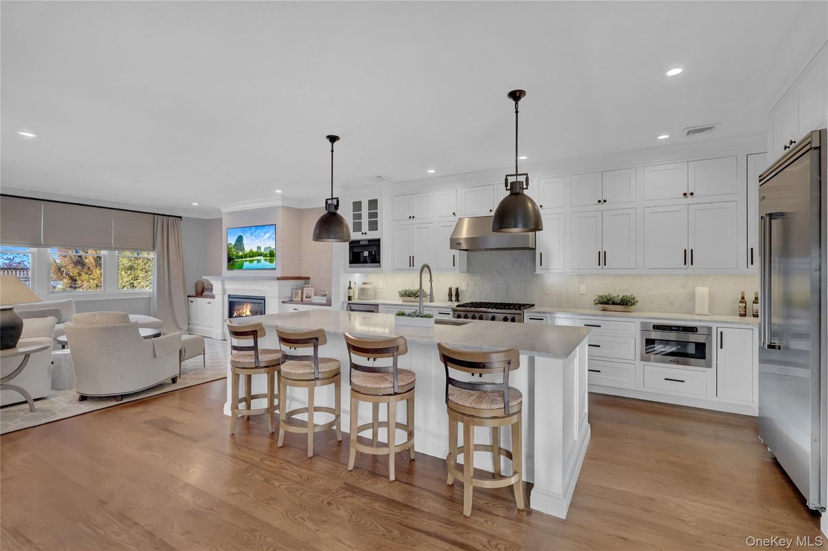 Fireplace, Interior, Kitchen, Living room, Pendant Lights, Recessed Lighting, Stainless Steel Appliances, Wood Texture Flooring