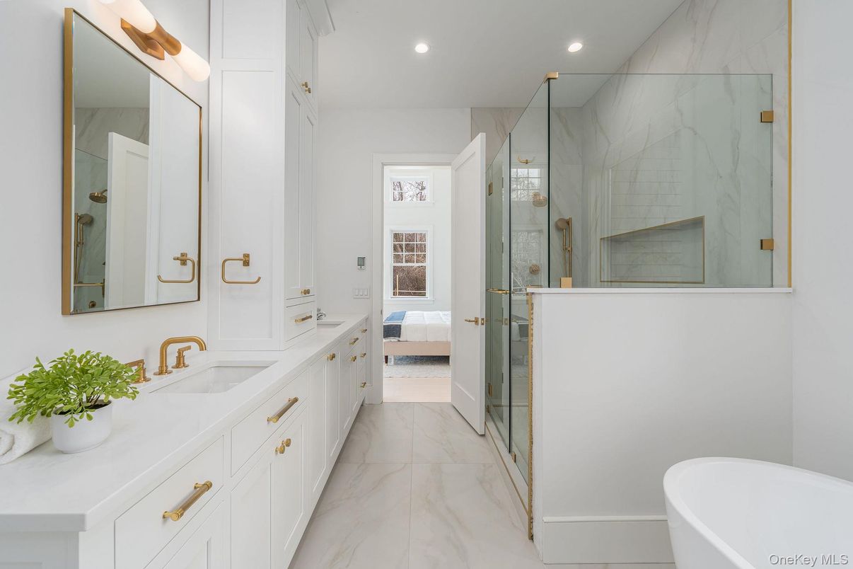 Bathroom, Dual Sink Vanities, Free Standing Baths, Glass Shower, Interior, Marble, Marble Walls, Recessed Lighting