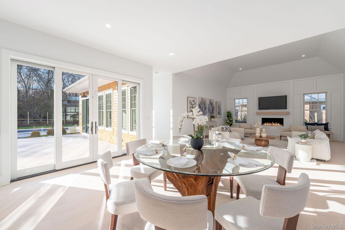 Dining room, Fireplace, Interior, Living room, Recessed Lighting, Wood Texture Flooring