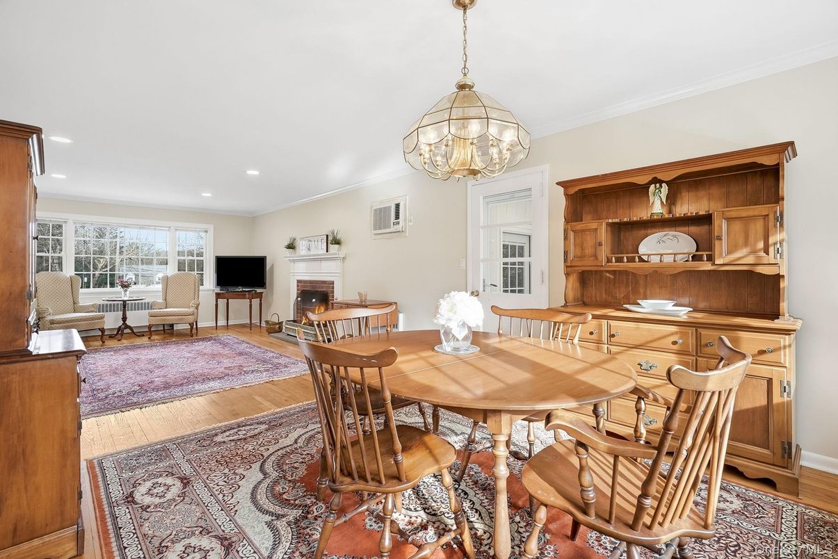 Dining room, Fireplace, Interior, Living room, Pendant Lights, Recessed Lighting, Wood Texture Flooring
