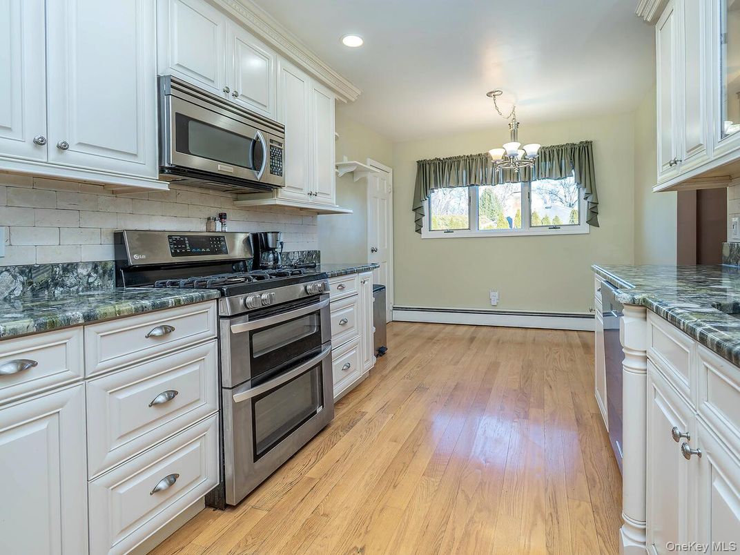 Chandelier, Interior, Kitchen, Pendant Lights, Recessed Lighting, Stainless Steel Appliances, Wood Texture Flooring