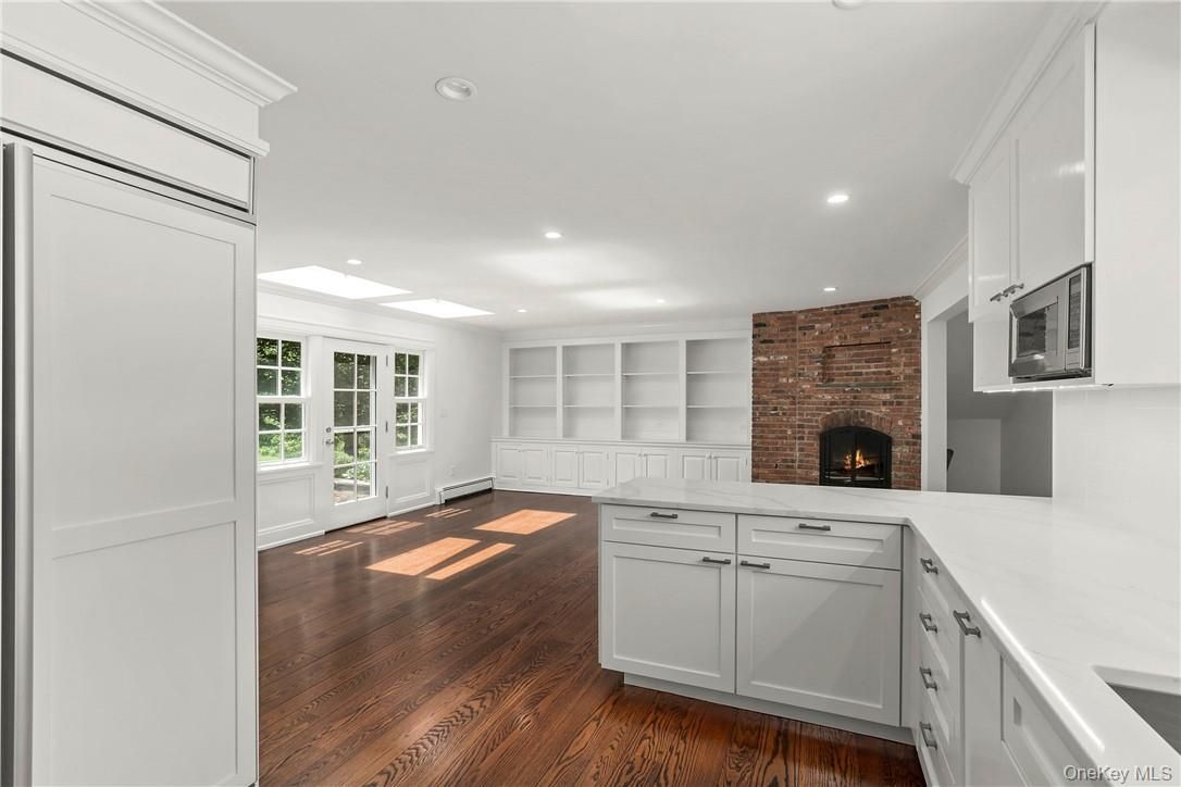 Fireplace, Interior, Kitchen, Recessed Lighting, Stone Walls, Wood Texture Flooring