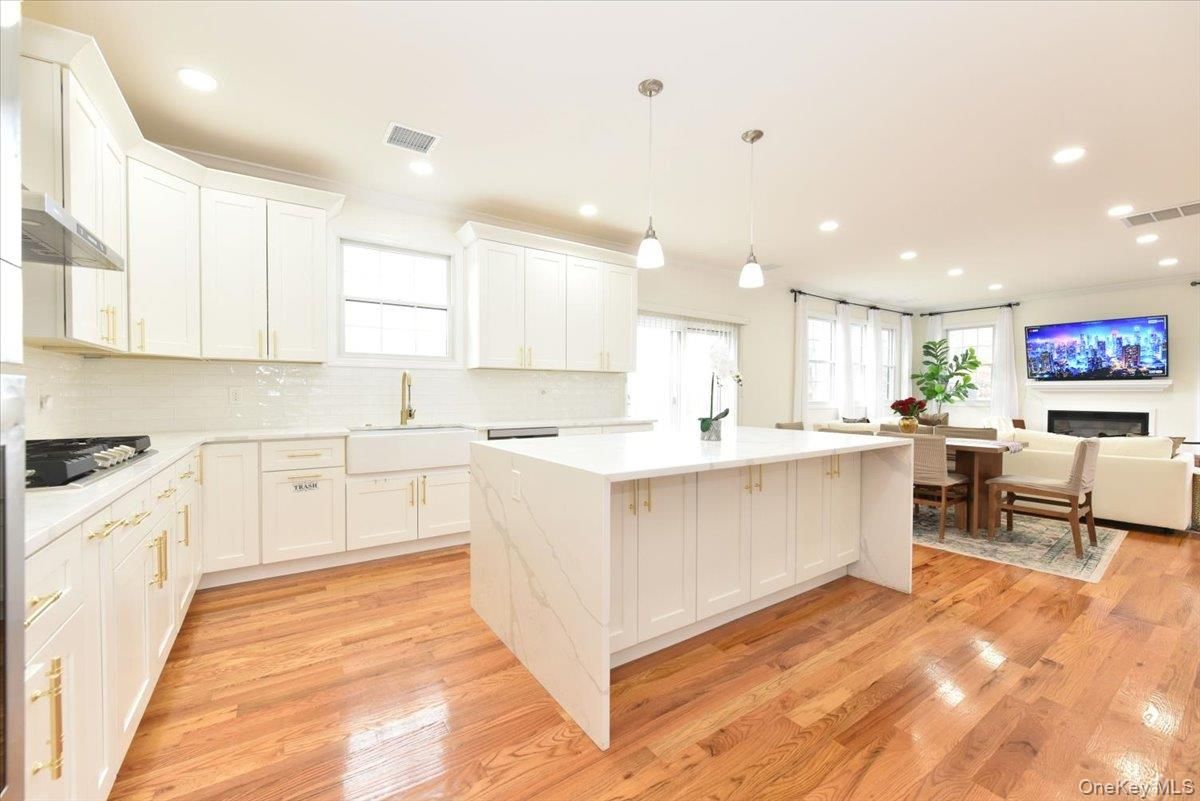 Dining room, Fireplace, Interior, Kitchen, Living room, Pendant Lights, Recessed Lighting, Wood Texture Flooring