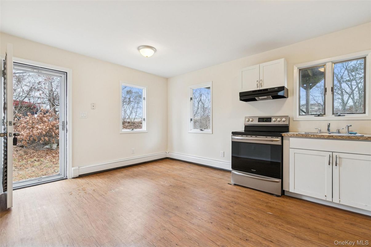 Empty room, Interior, Kitchen, Stainless Steel Appliances, Wood Texture Flooring