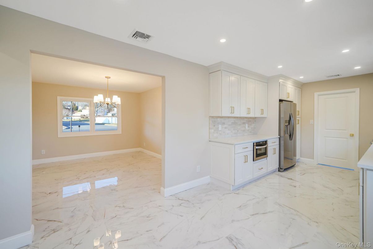 Chandelier, Empty room, Interior, Kitchen, Marble, Recessed Lighting, Stainless Steel Appliances