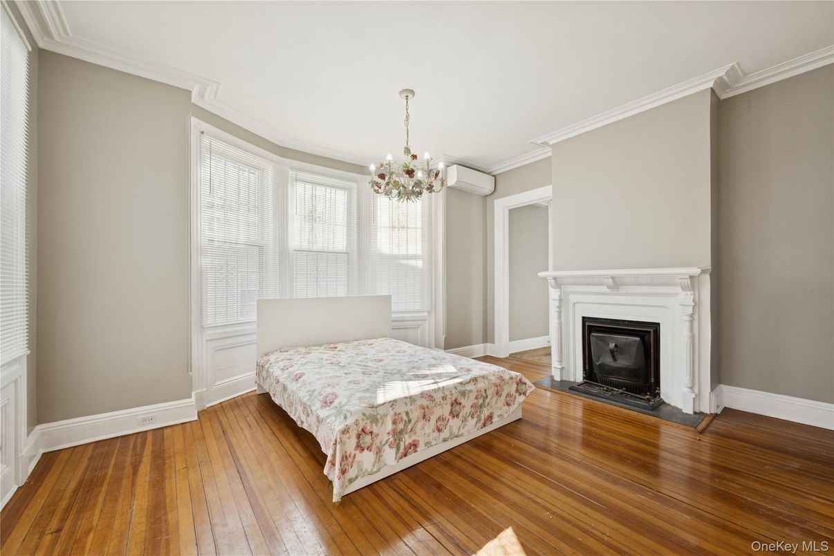 Bedroom, Chandelier, Fireplace, Interior, Wood Texture Flooring