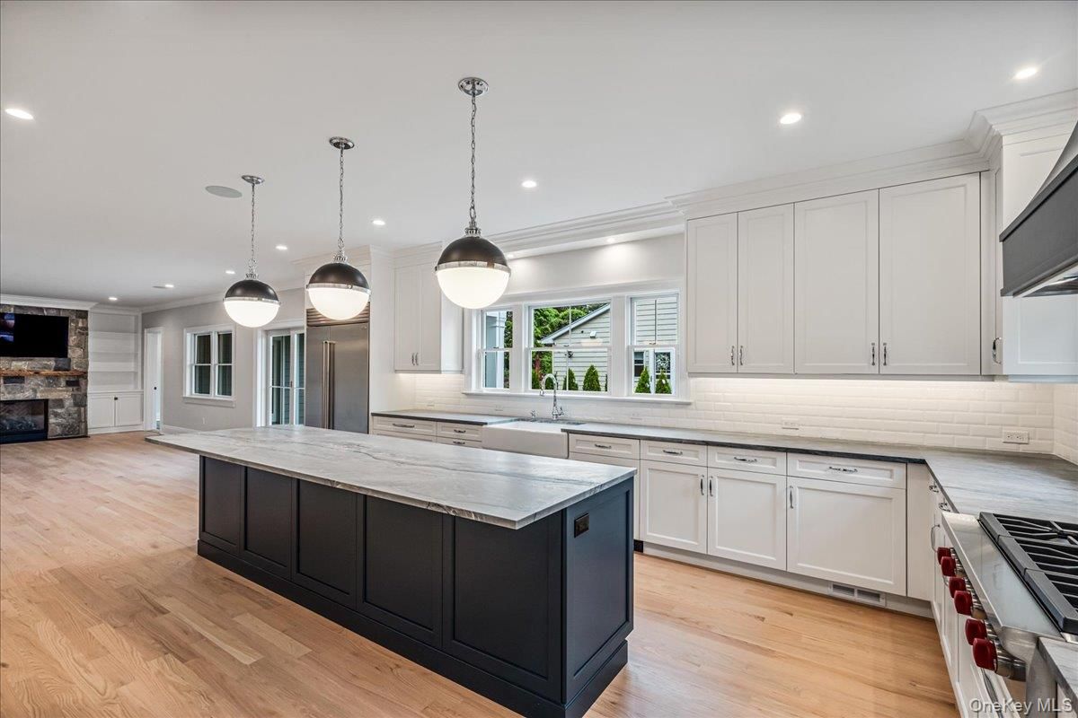 Fireplace, Interior, Kitchen, Pendant Lights, Recessed Lighting, Stainless Steel Appliances, Wood Texture Flooring