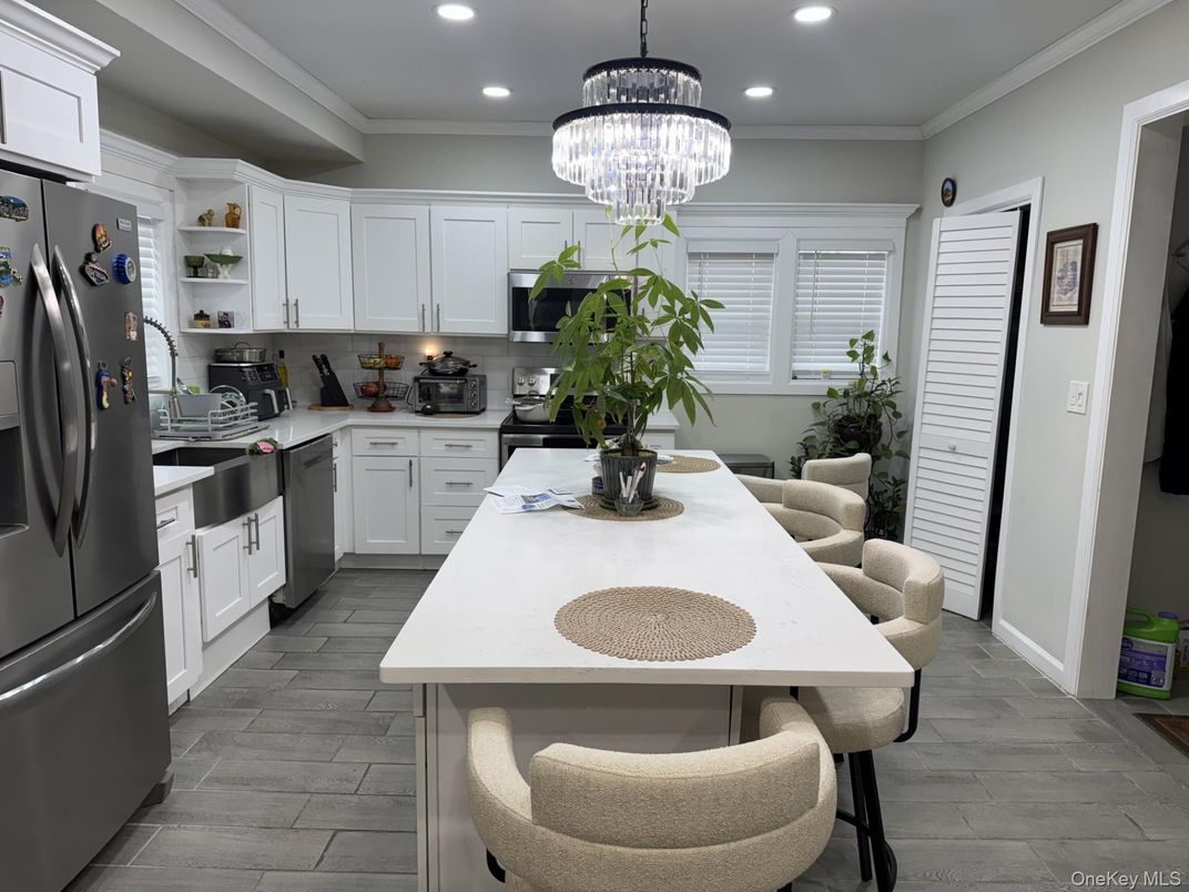 Chandelier, Dining room, Interior, Kitchen, Recessed Lighting, Stainless Steel Appliances, Wood Texture Flooring