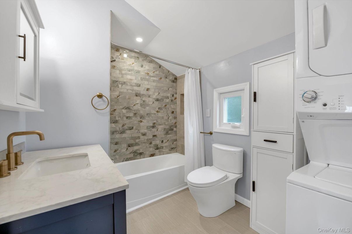 Bathroom, Interior, Recessed Lighting, Washer, Wood Texture Flooring