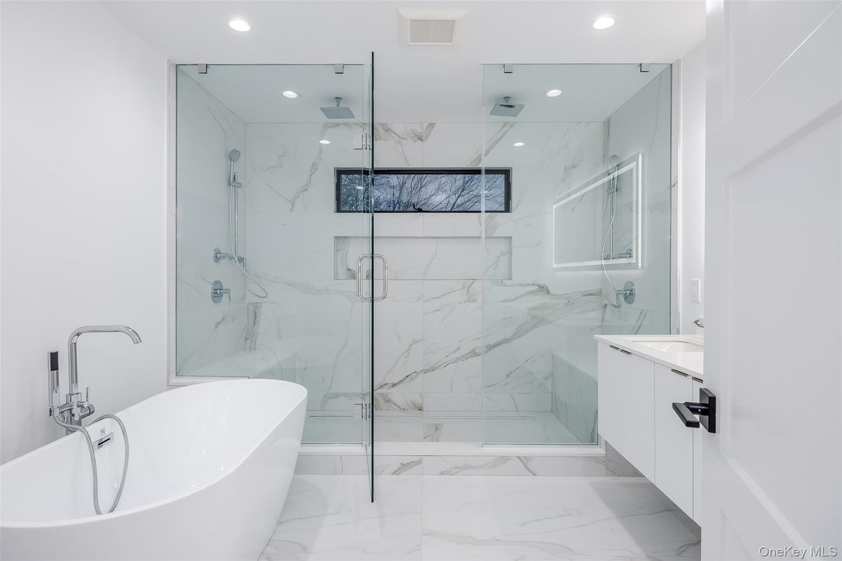 Bathroom, Free Standing Baths, Glass Shower, Interior, Marble, Marble Walls, Recessed Lighting