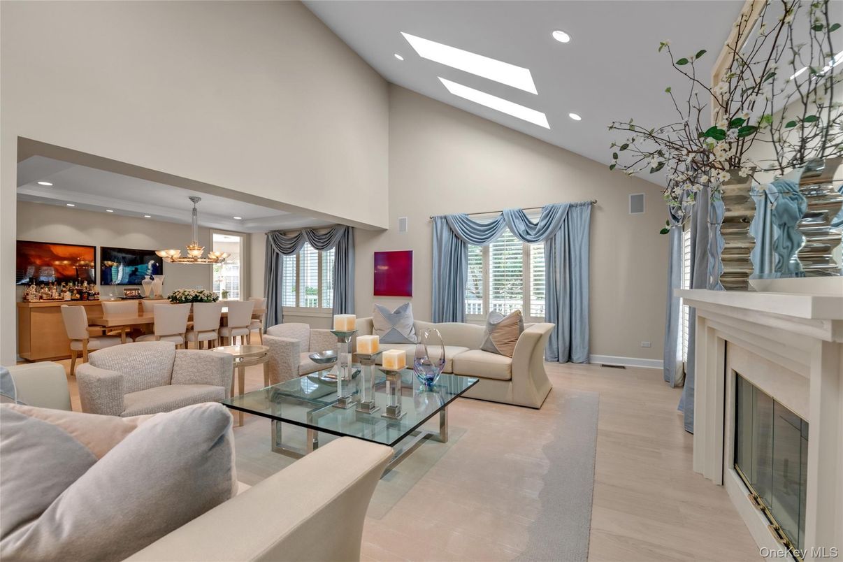 Chandelier, Dining room, Fireplace, Interior, Living room, Pendant Lights, Recessed Lighting, Wood Texture Flooring