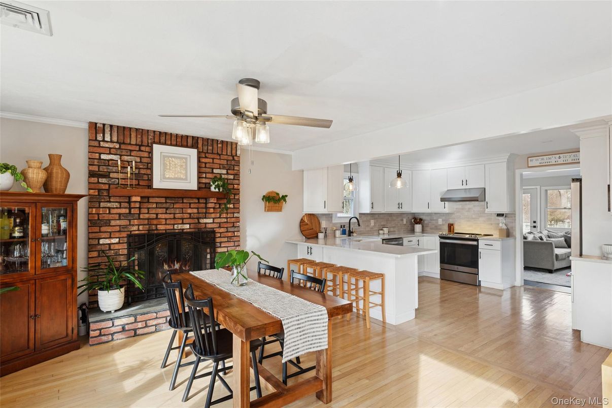 Dining room, Fireplace, Interior, Kitchen, Living room, Pendant Lights, Stone Walls, Wood Texture Flooring