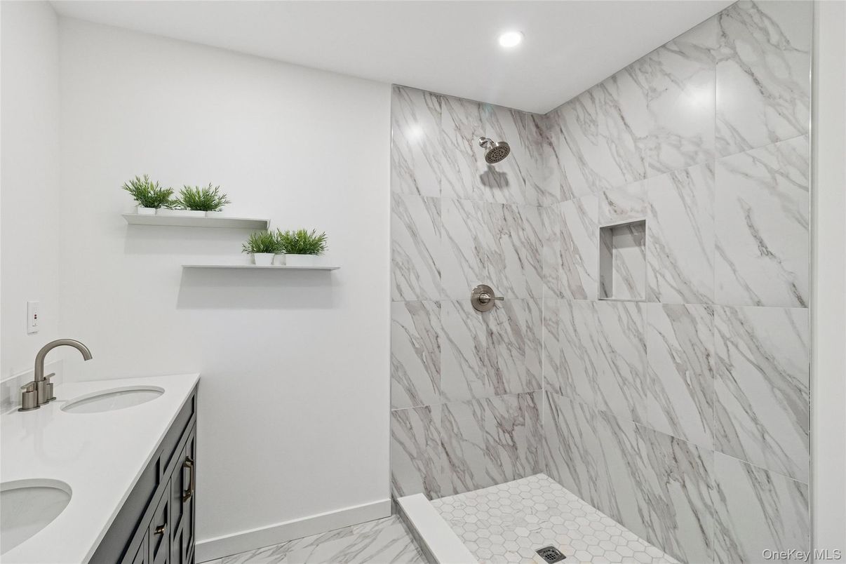 Bathroom, Dual Sink Vanities, Interior, Marble, Marble Walls, Recessed Lighting