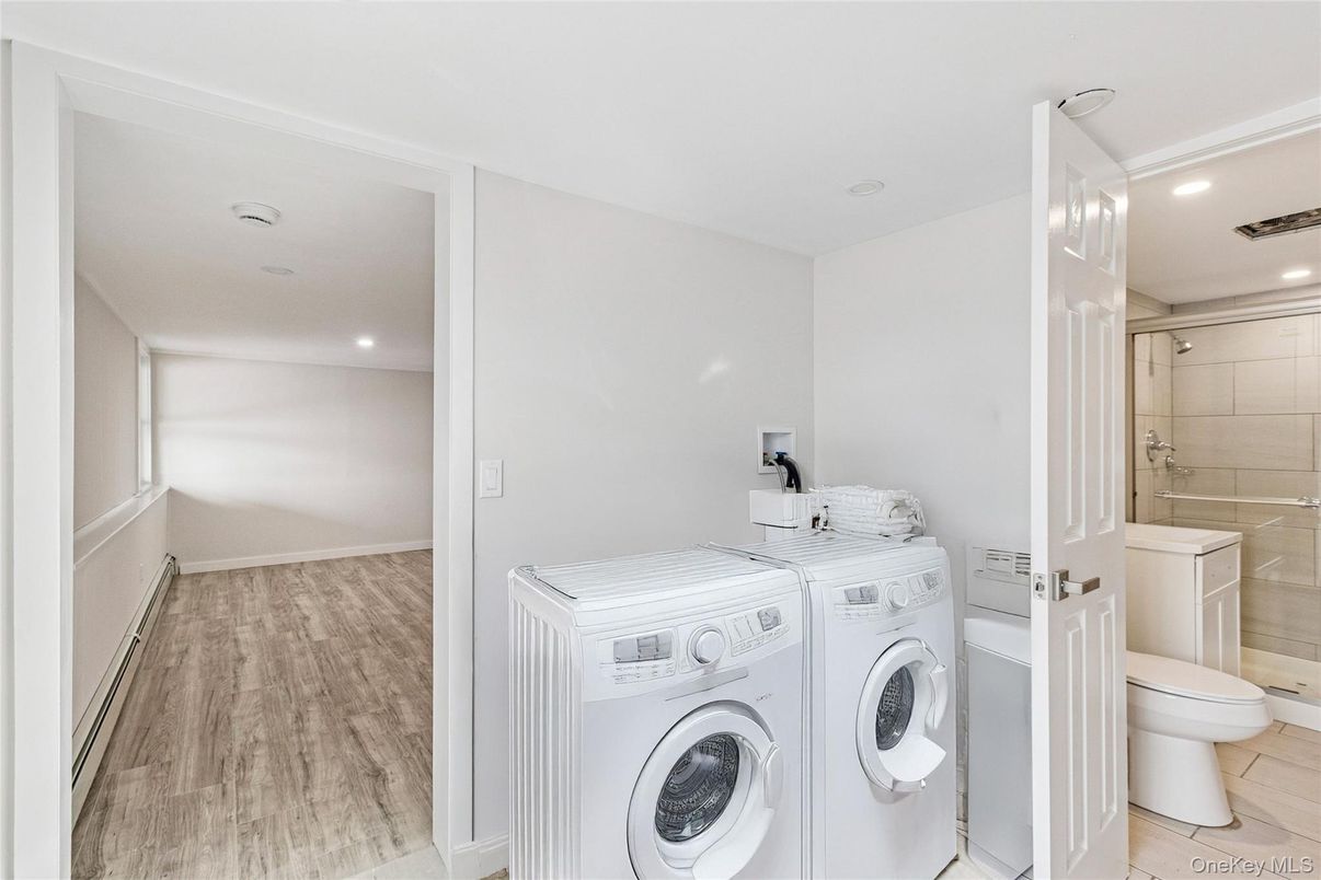 Bathroom, Interior, Recessed Lighting, Washer, Wood Texture Flooring