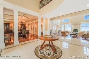 Chandelier, Dining room, Fireplace, Interior, Living room, Recessed Lighting, Wood Texture Flooring