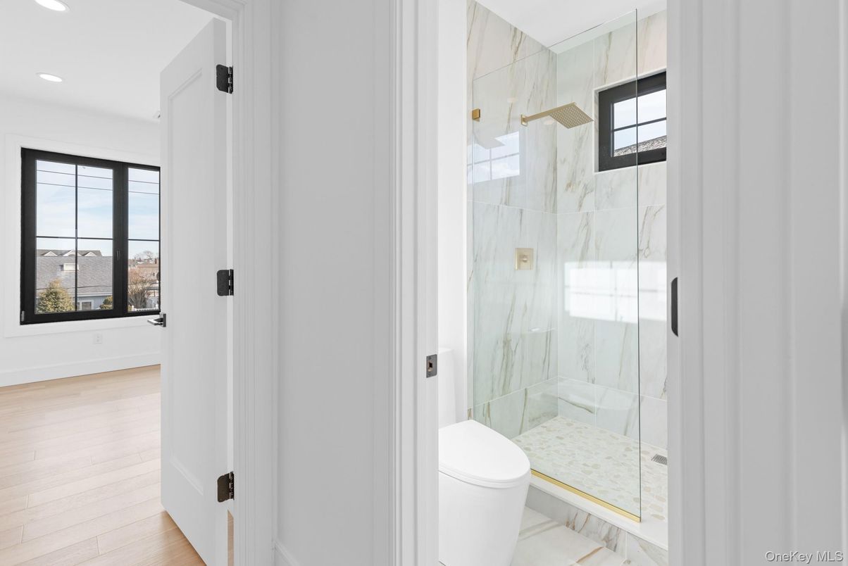 Bathroom, Glass Shower, Interior, Marble, Marble Walls, Recessed Lighting, Wood Texture Flooring