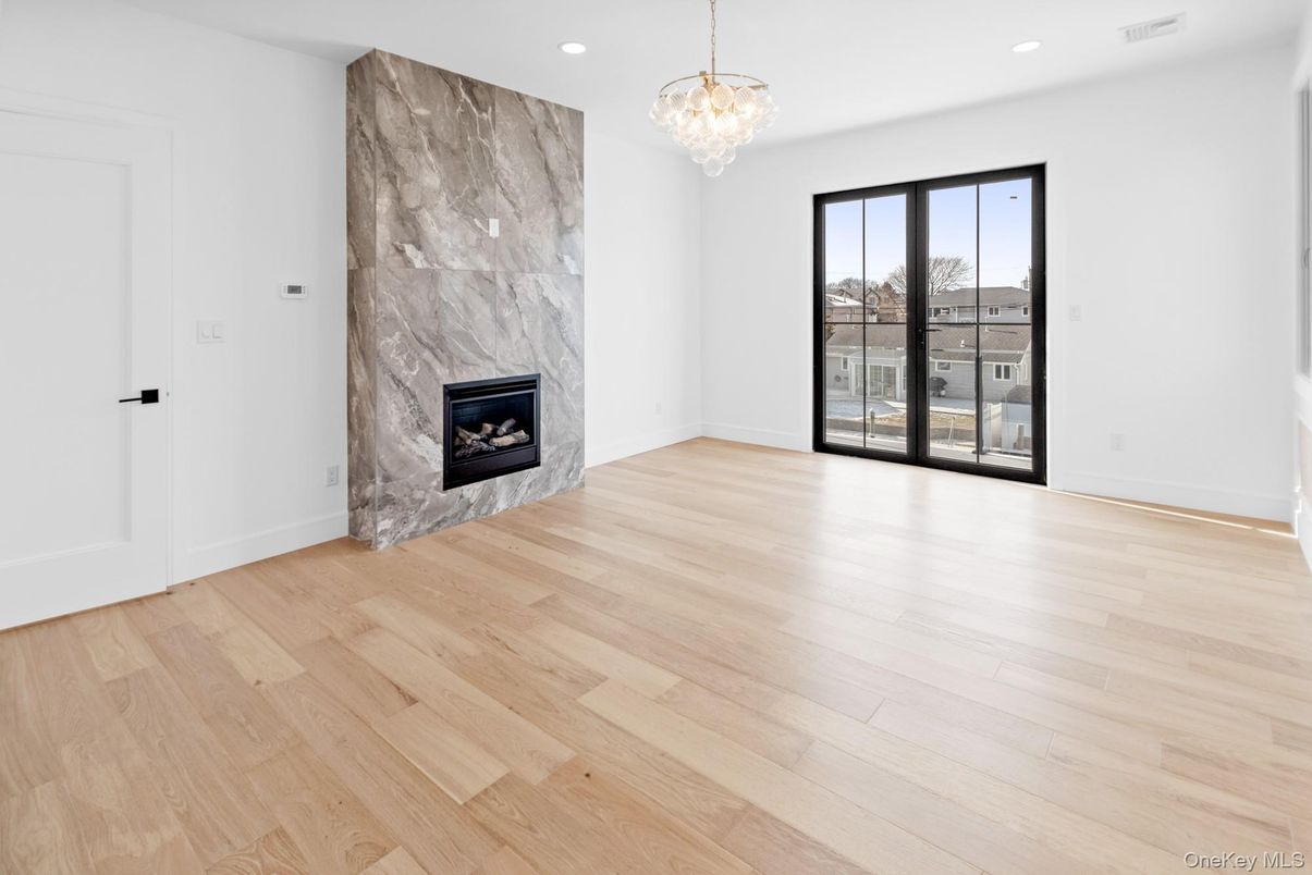 Chandelier, Empty room, Fireplace, Interior, Recessed Lighting, Wood Texture Flooring