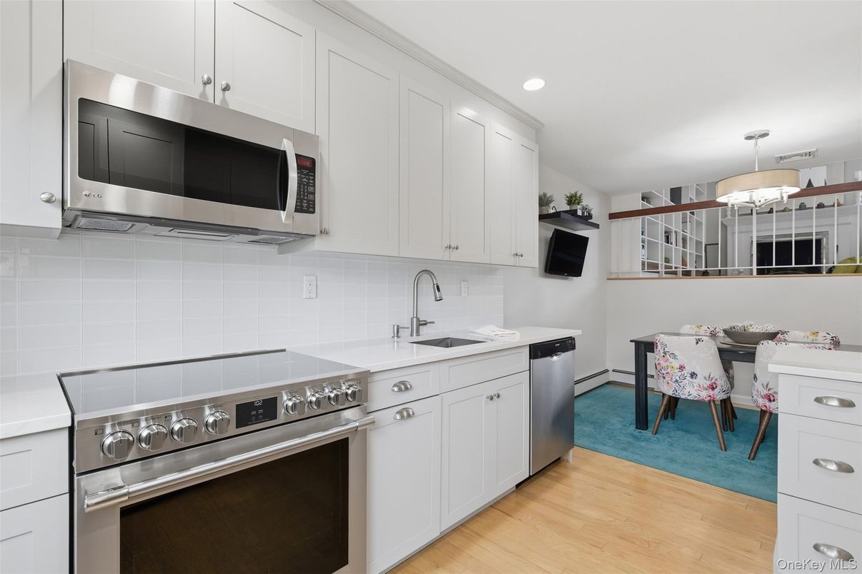 Dining room, Interior, Kitchen, Recessed Lighting, Stainless Steel Appliances, Wood Texture Flooring