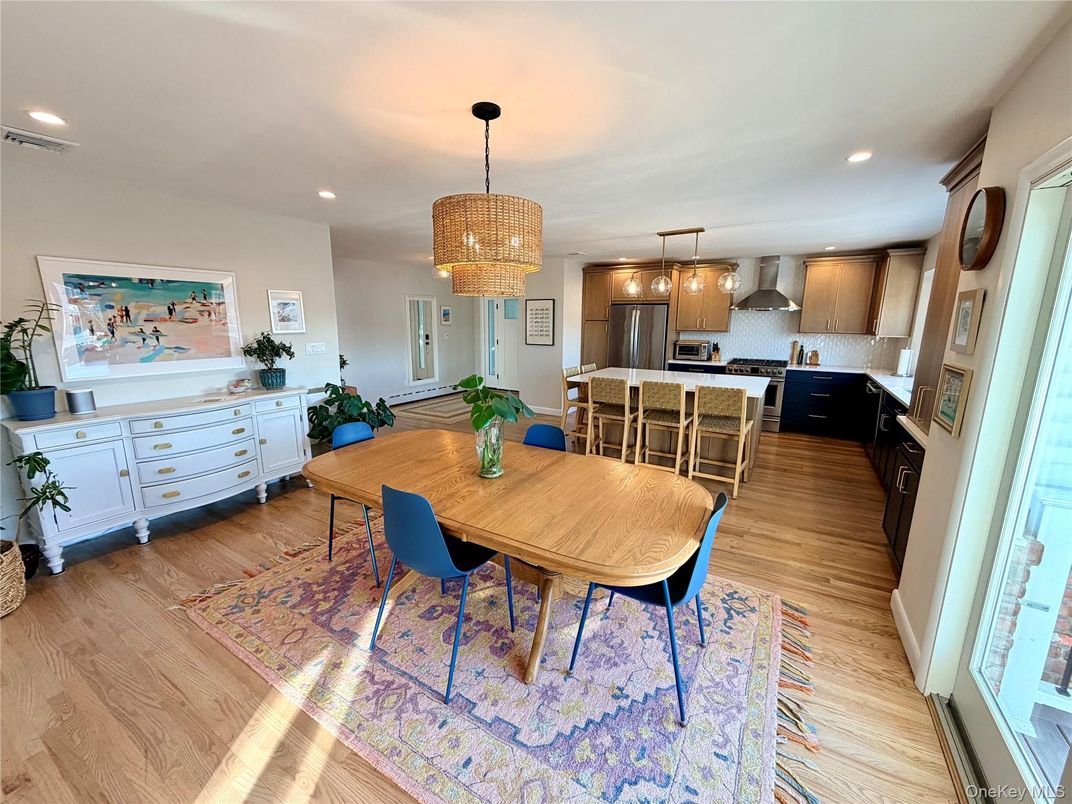 Chandelier, Dining room, Interior, Kitchen, Pendant Lights, Recessed Lighting, Stainless Steel Appliances, Wood Texture Flooring