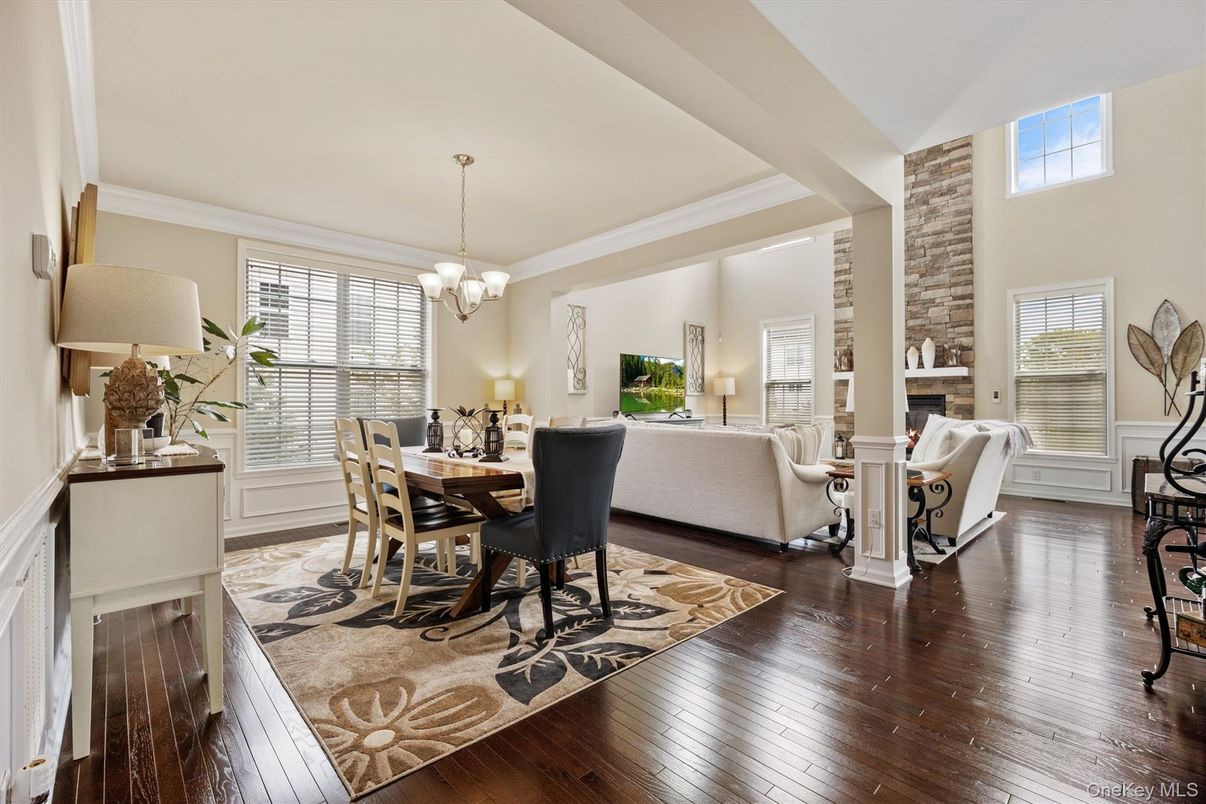 Chandelier, Dining room, Fireplace, Interior, Living room, Stone Walls, Wood Texture Flooring