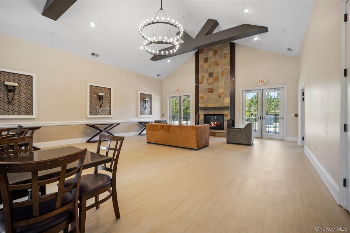 Chandelier, Dining room, Fireplace, Interior, Living room, Pendant Lights, Recessed Lighting, Wood Texture Flooring