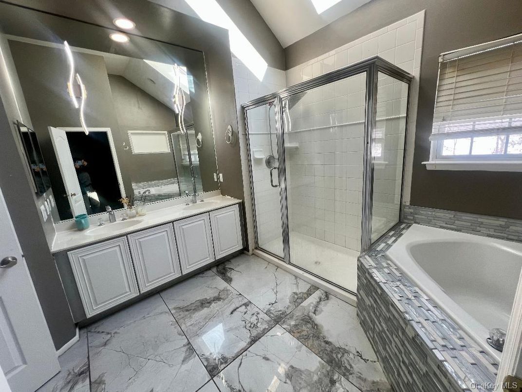 Bathroom, Dual Sink Vanities, Glass Shower, Interior, Marble, Recessed Lighting