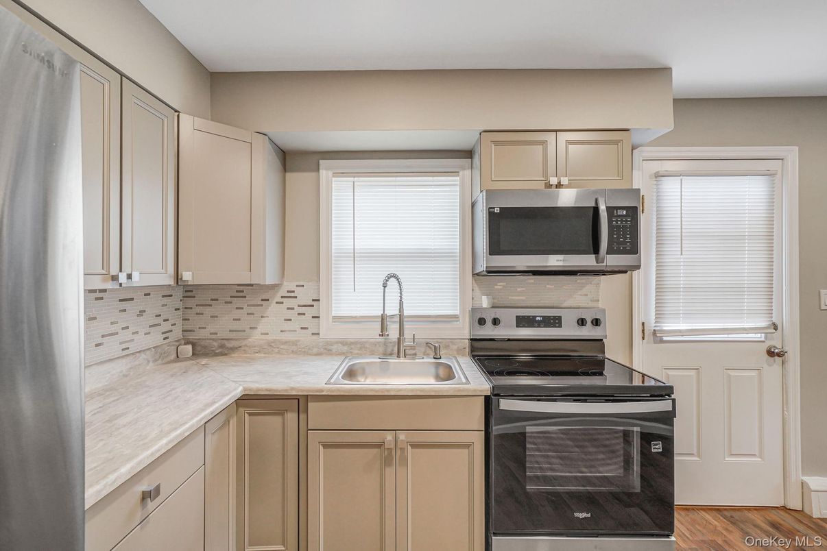 Interior, Kitchen, Stainless Steel Appliances, Tile Countertops, Wood Texture Flooring