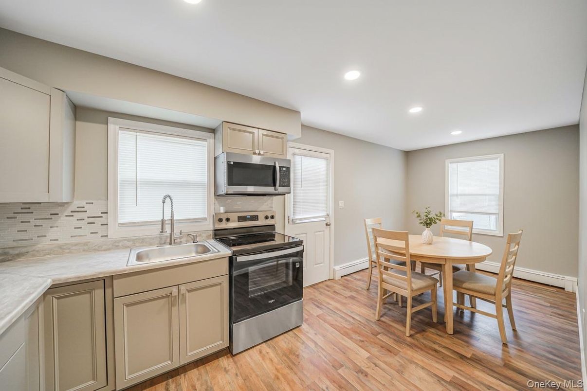 Dining room, Interior, Kitchen, Recessed Lighting, Stainless Steel Appliances, Wood Texture Flooring