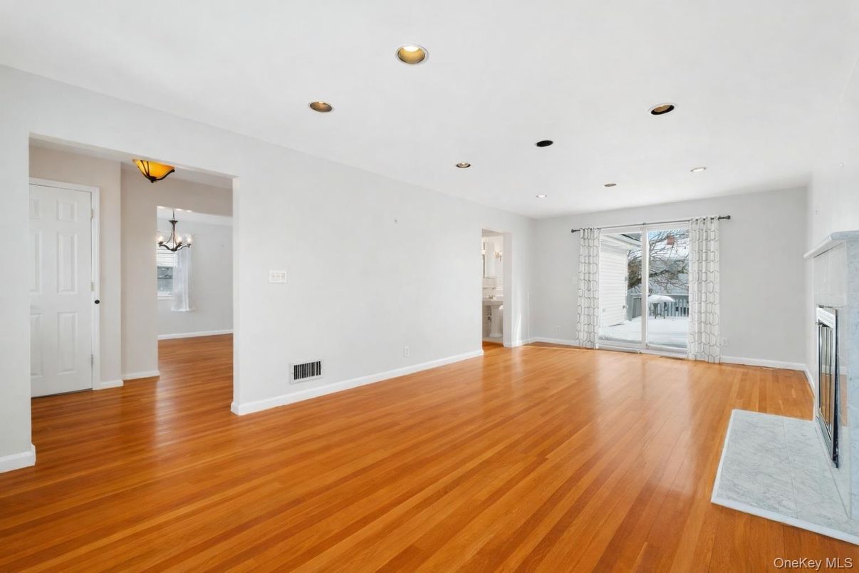 Empty room, Fireplace, Interior, Recessed Lighting, Wood Texture Flooring