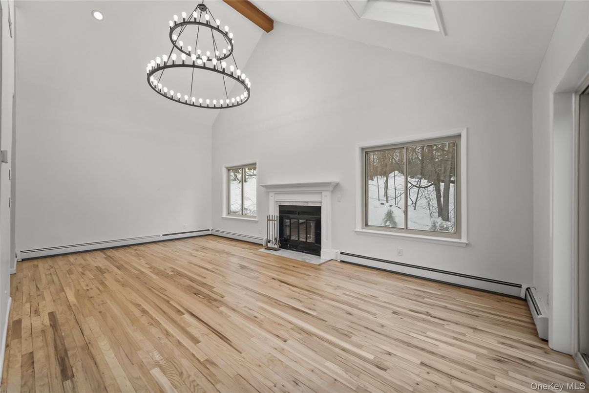 Empty room, Fireplace, Interior, Pendant Lights, Recessed Lighting, Wooden Beams, Wood Texture Flooring