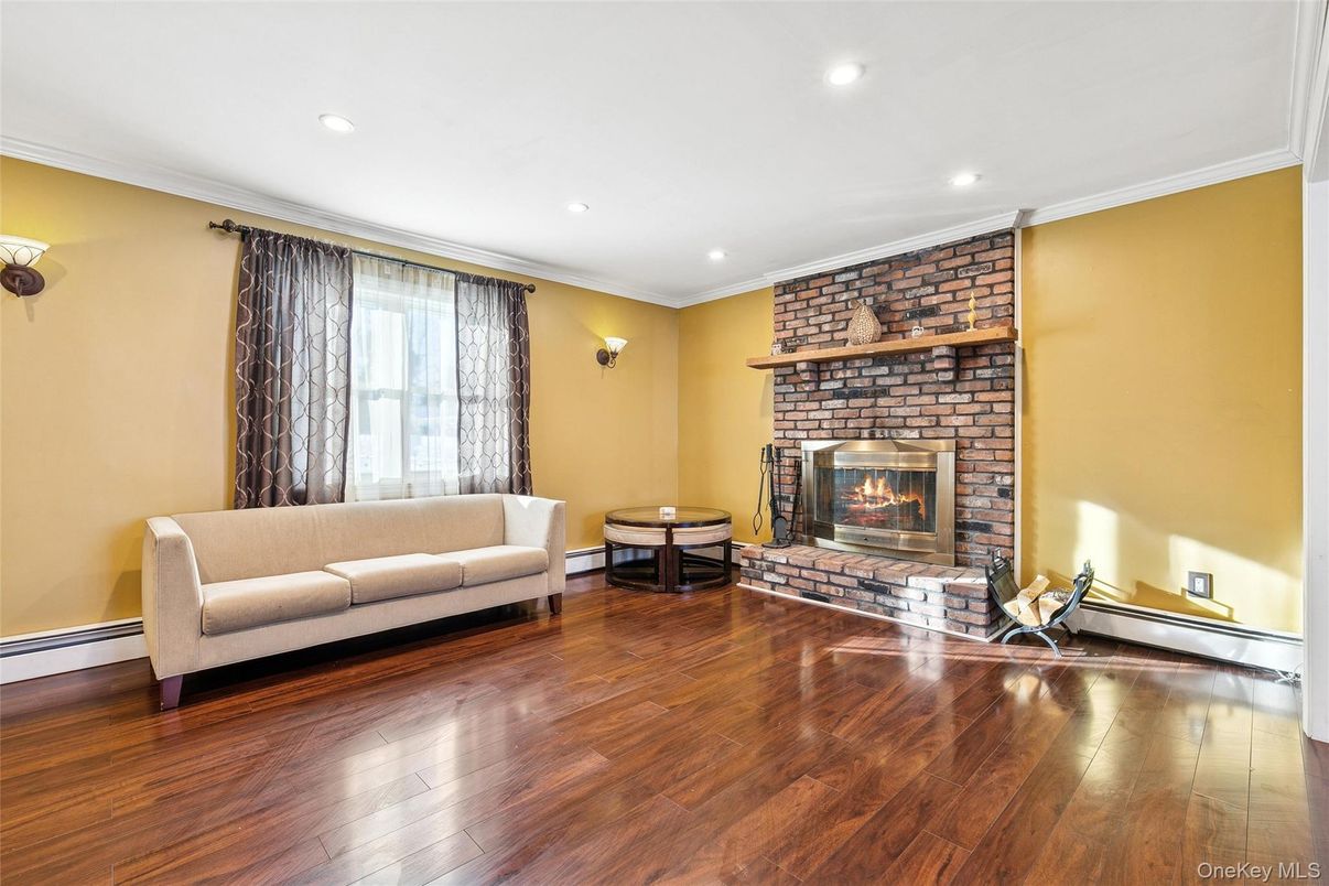 Fireplace, Interior, Living room, Recessed Lighting, Stone Walls, Wood Texture Flooring