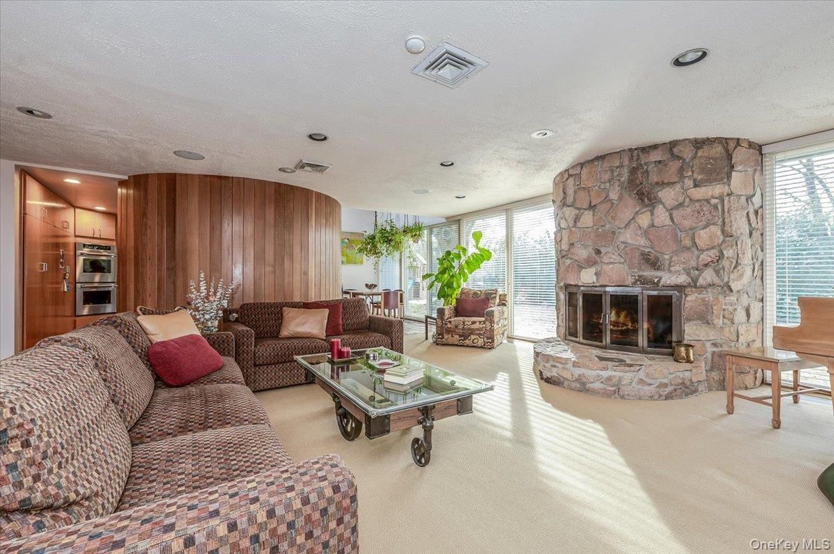 Fireplace, Interior, Kitchen, Living room, Recessed Lighting, Stainless Steel Appliances, Stone Walls