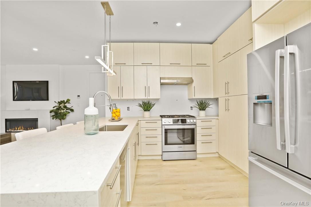 Fireplace, Interior, Kitchen, Pendant Lights, Recessed Lighting, Stainless Steel Appliances, Wood Texture Flooring