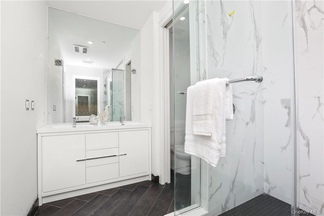 Bathroom, Glass Shower, Interior, Marble Walls, Recessed Lighting, Wood Texture Flooring