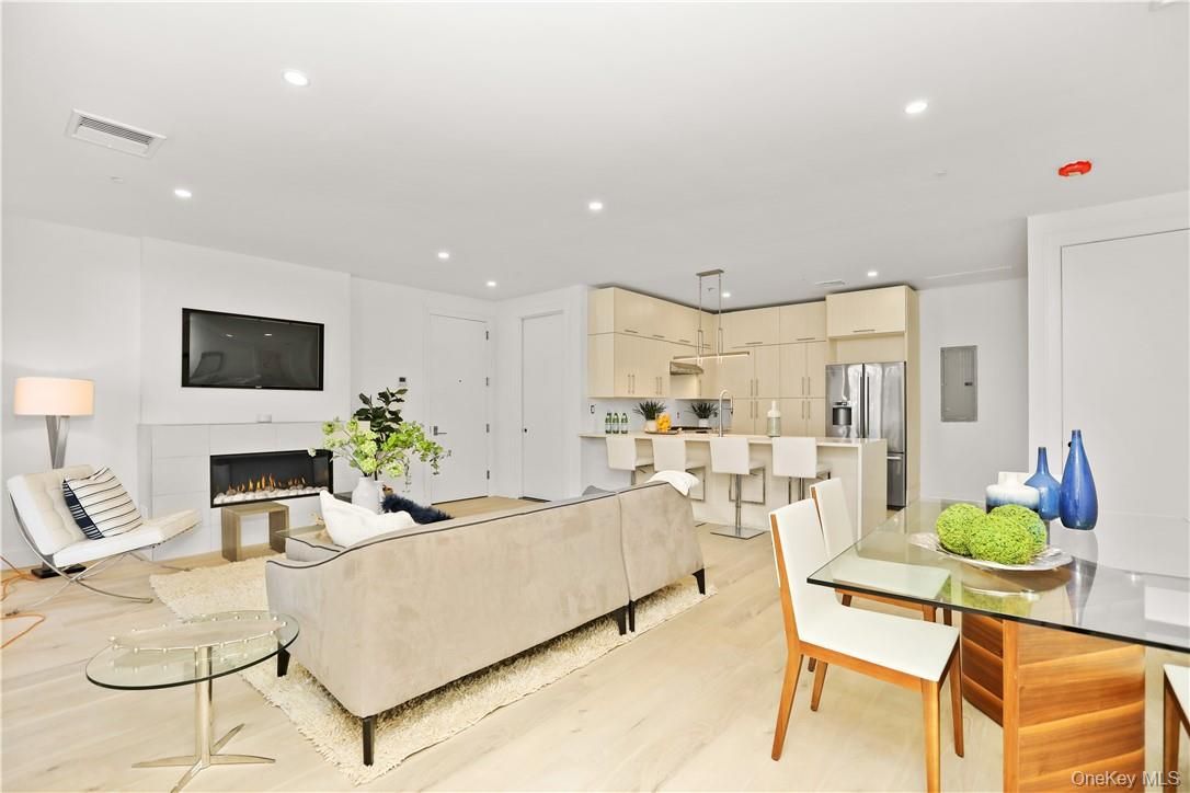 Dining room, Fireplace, Interior, Kitchen, Living room, Pendant Lights, Recessed Lighting, Stainless Steel Appliances, Wood Texture Flooring