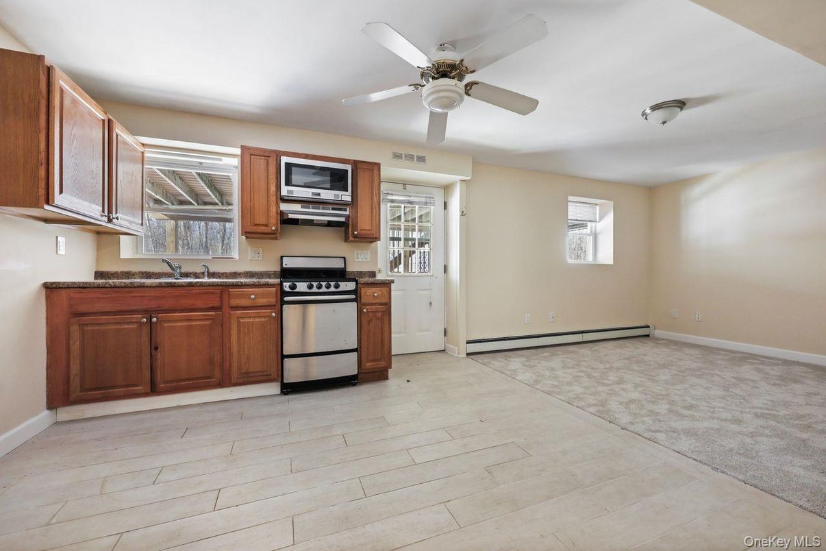 Empty room, Interior, Kitchen, Stainless Steel Appliances, Wood Texture Flooring
