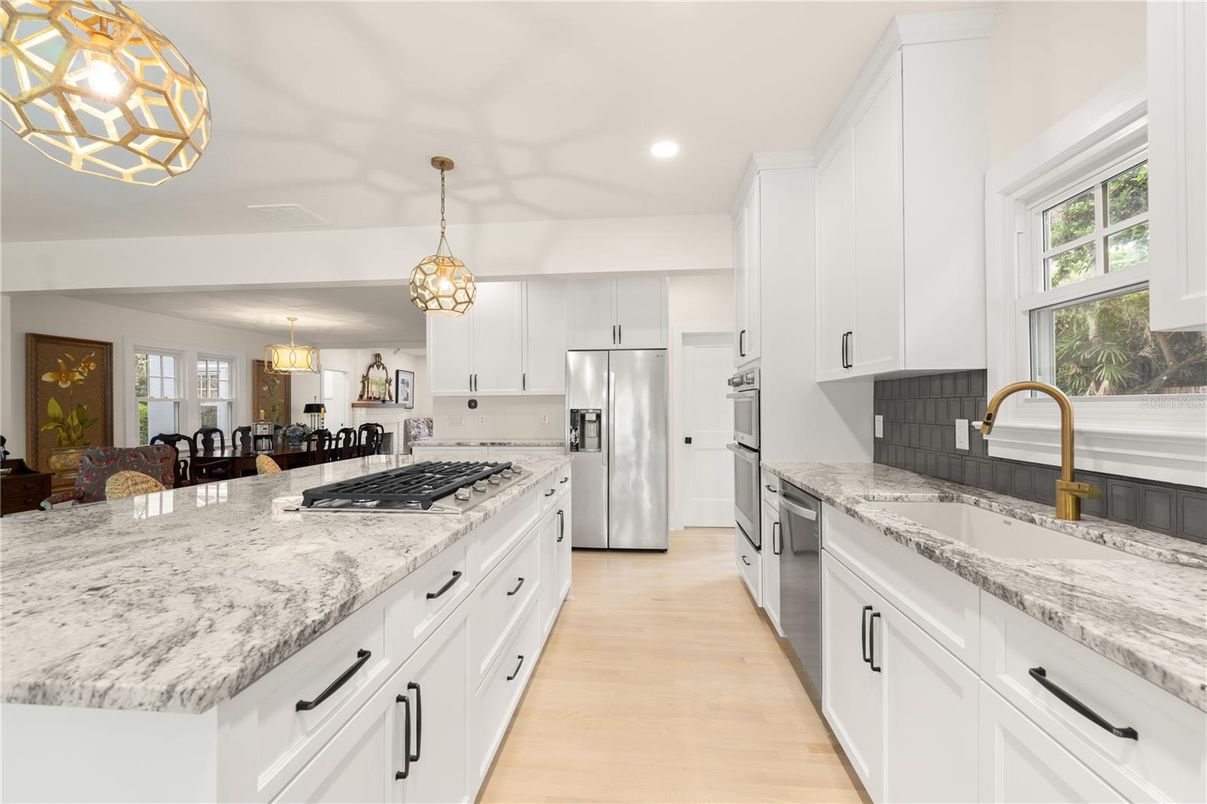 Chandelier, Dining room, Interior, Kitchen, Pendant Lights, Recessed Lighting, Stainless Steel Appliances, Wood Texture Flooring