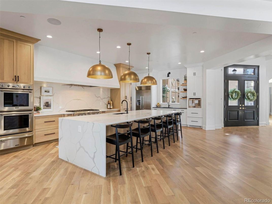 Interior, Kitchen, Marble Walls, Pendant Lights, Recessed Lighting, Stainless Steel Appliances, Wood Texture Flooring