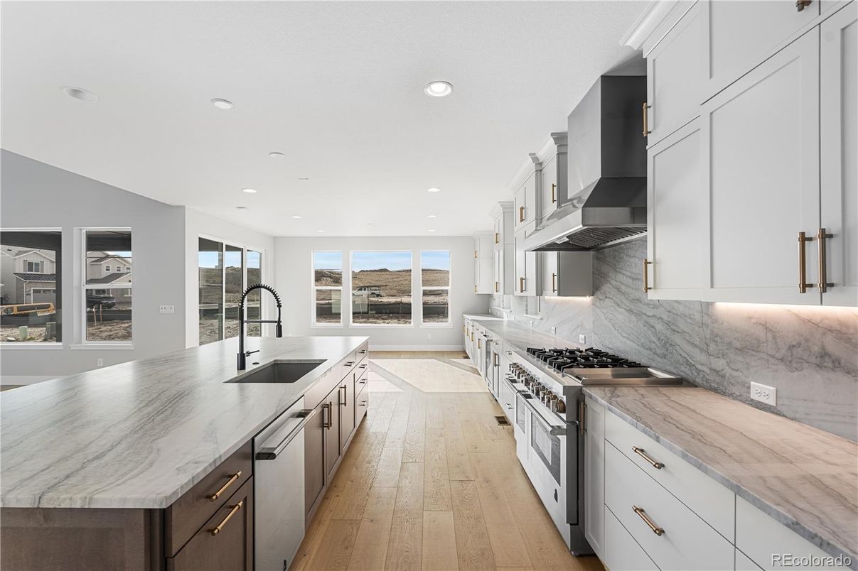 Interior, Kitchen, Marble Walls, Recessed Lighting, Stainless Steel Appliances, Wood Texture Flooring