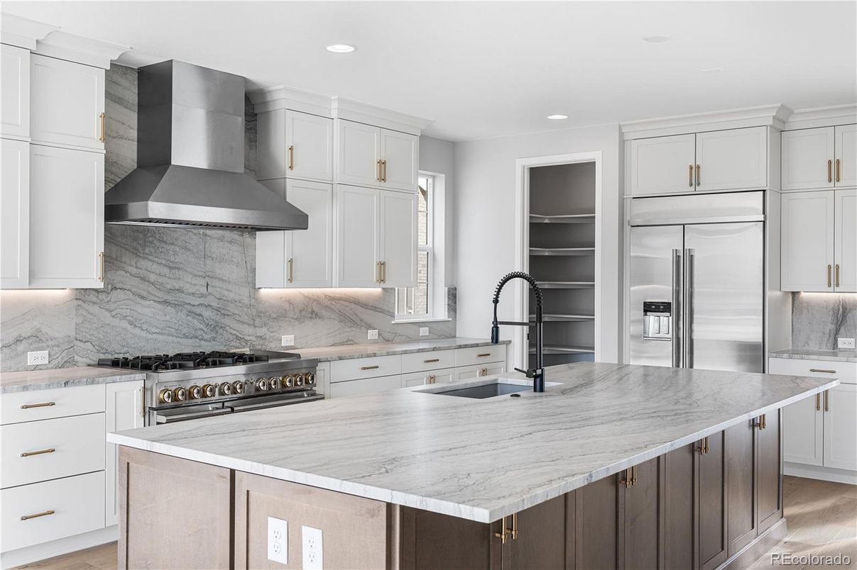 Interior, Kitchen, Marble Walls, Recessed Lighting, Stainless Steel Appliances, Wood Texture Flooring